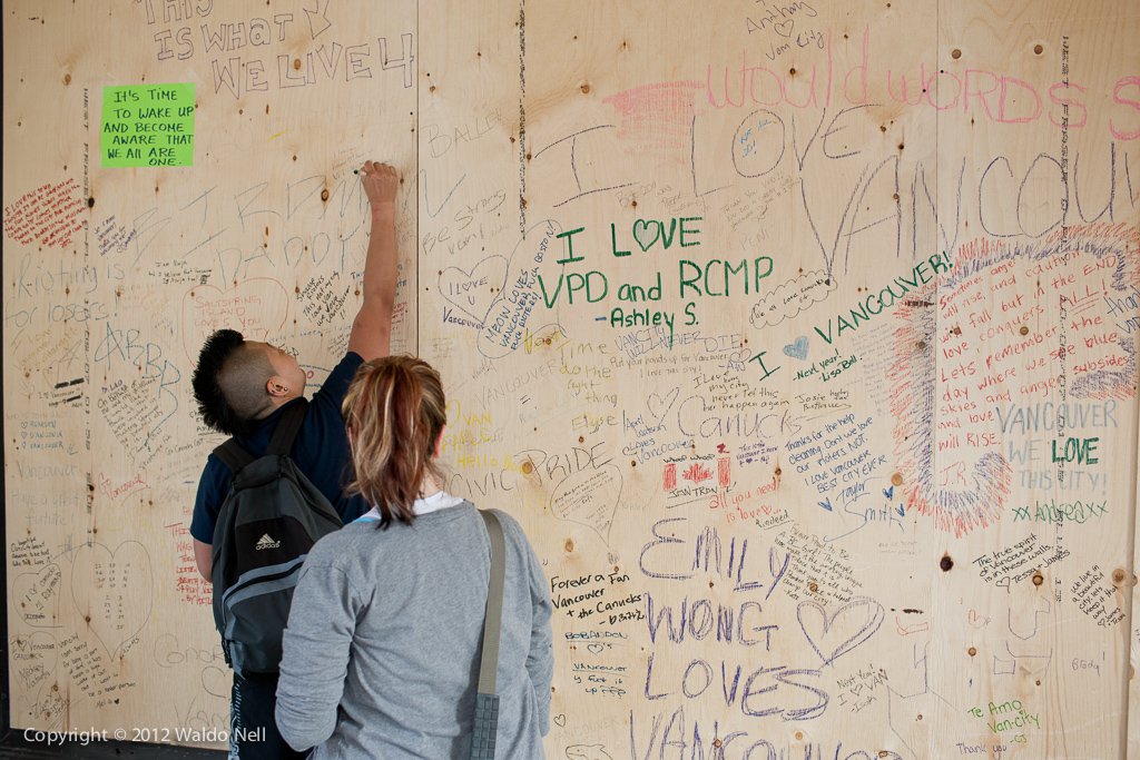 People raising their dismay at what happened in downtown Vancouver.